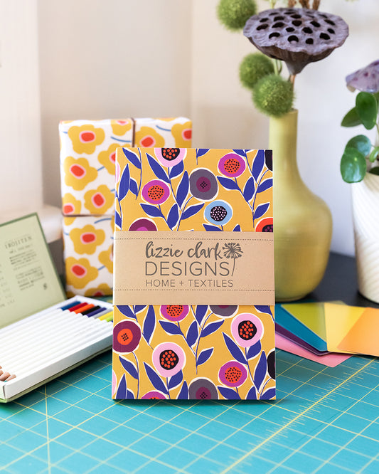 Button Flowers Yellow Journal – Softcover Dot Grid Notebook with Hand-Drawn Pattern, Recycled Pages, and a Mission to Build Schools
